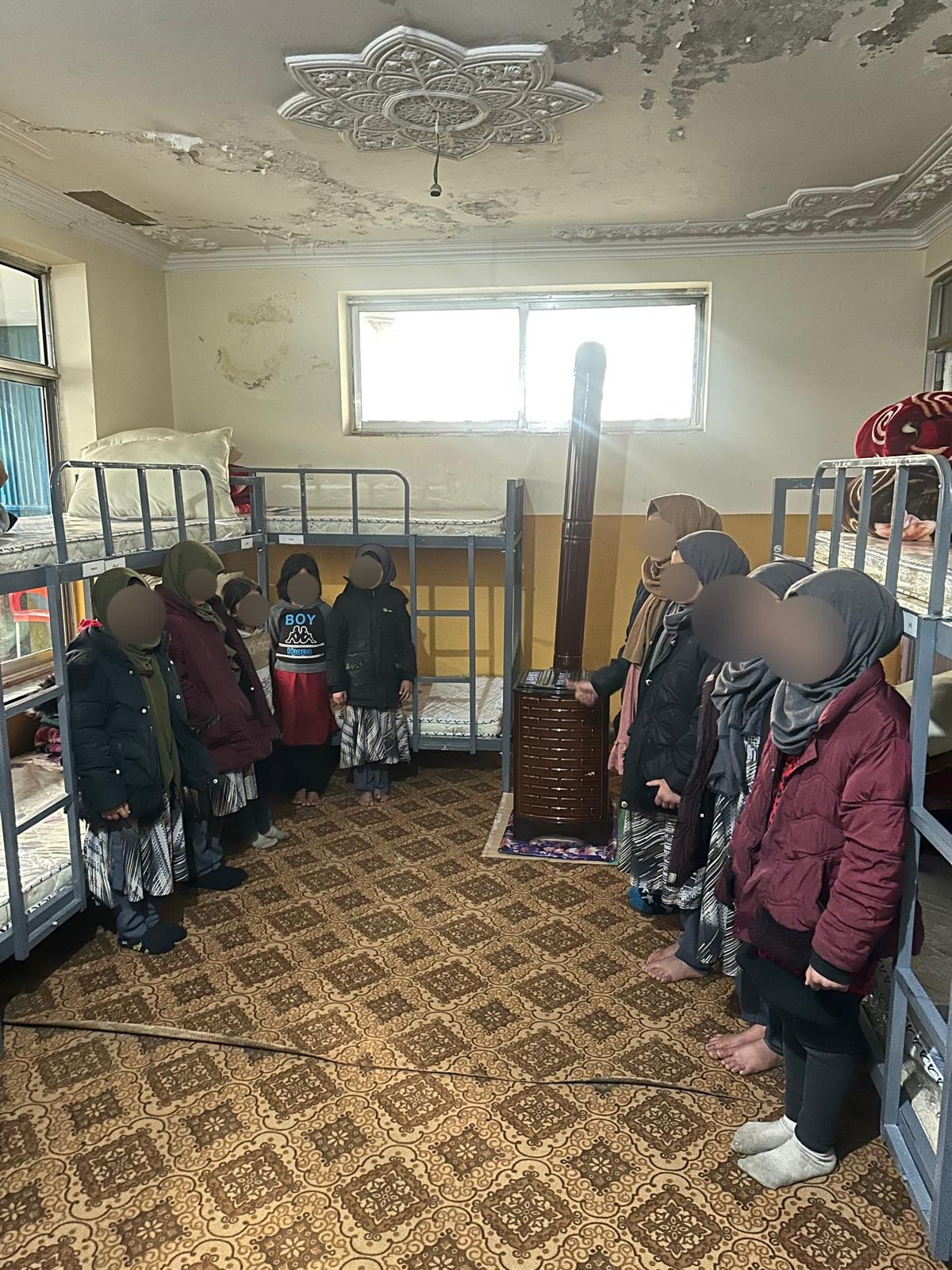 Girls in a dormitory room at a partner care facility