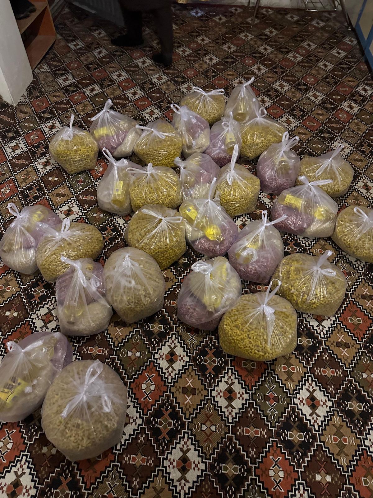 Bagged pasta and rice portions prepared for families